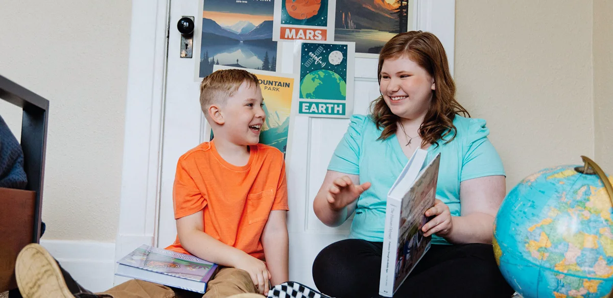 boy and girl smiling and learning